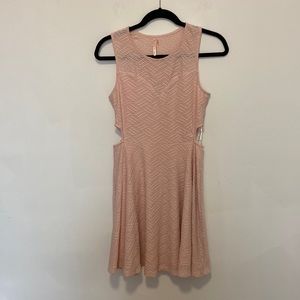 Pink skater style dress with cutouts